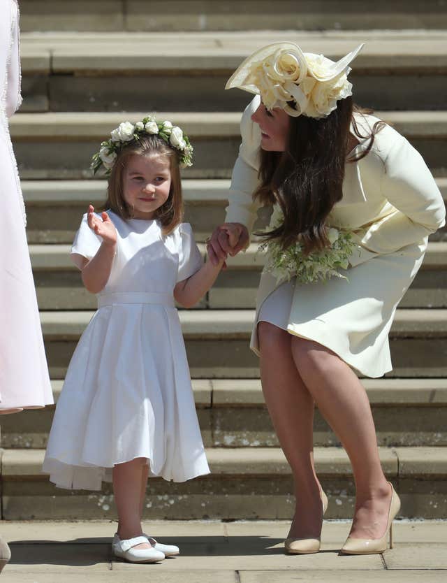 Princess Charlotte and the Duchess of Cambridge on the steps of St George’s Chapel after the wedding (Jane Barlow/PA)