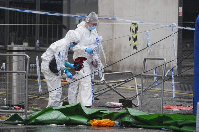Forensic officers at the scene in Water Street near the Liver Building in Liverpool after the victory parade
