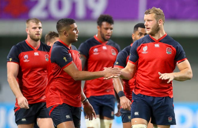 Joe Launchbury, centre right, shakes hands with Lewis Ludlam after the final whistle in Kobe