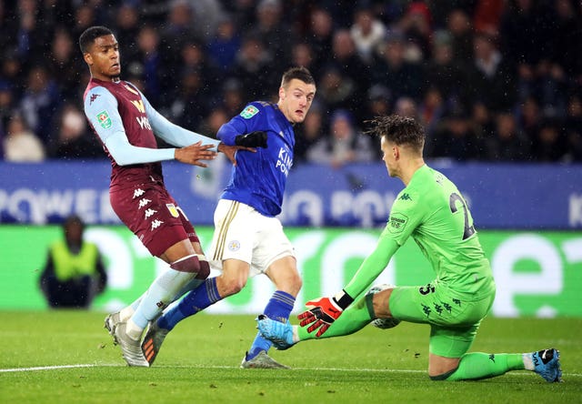 Orjan Nyland, right, saves from Jamie Vardy, centre