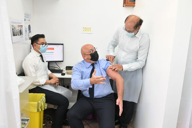 Nadhim Zahawi, while Vaccines Minister, receives his second dose of the Covid-19 vaccination (Dominic Lipinski/PA)