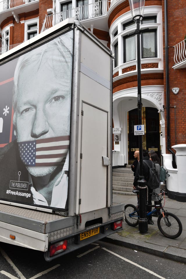 A poster showing Julian Assange gagged by an American flag