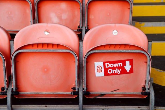 Signage at Blackpool's Bloomfield Road helps supporters abide by social distancing rules within the stadium 