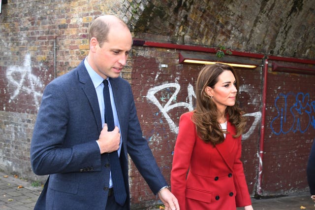 The Duke and Duchess of Cambridge during a visit to view some of the images from the Hold Still photography project at Waterloo Station in London. Evening Standard/Jeremy Selwyn