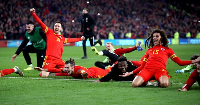 Wales' Aaron Ramsey (10), Gareth Bale (centre) and Ethan Ampadu (15) celebrate after securing qualification for Euro 2020