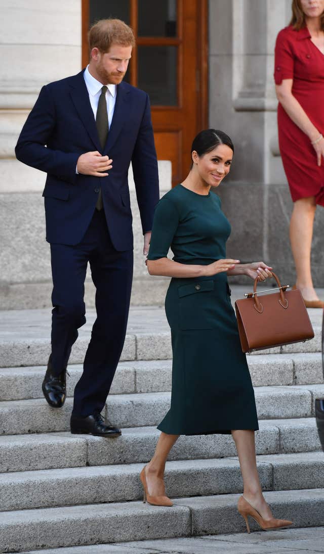 The Duke and Duchess of Sussex leave Government Buildings following a meeting with Taoiseach, Leo Varadkar during their visit to Dublin, Ireland.