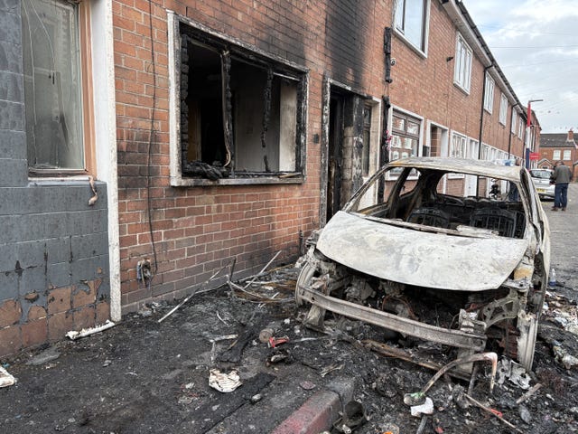 Burned out cars and houses on Lendrick Street in east Belfast