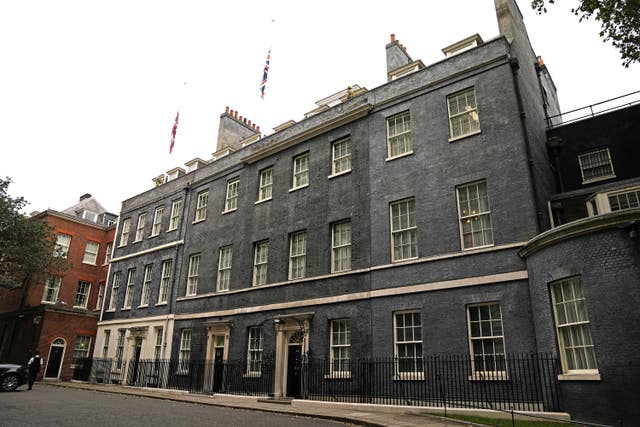 The Union flags above Downing Street have been lowered to half-mast after Conservative MP Sir David Amess died