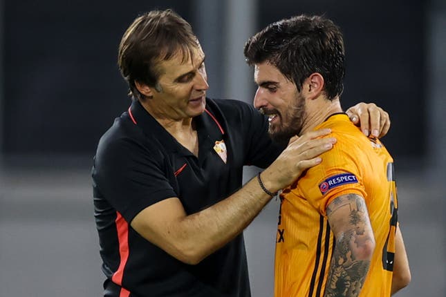 Sevilla coach Julen Lopetegui talks to Wolves midfielder Ruben Neves after the final whistle