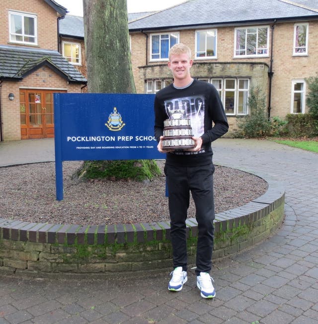 Kyle Edmund poses outside his former school with a replica of the Davis Cup (Pocklington School/PA)