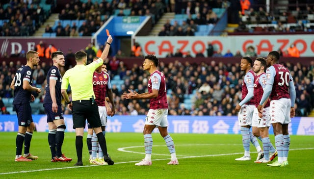 Ezri Konsa, third right, is sent off