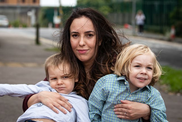 Stella Moris and sons Gabriel, right, and Max