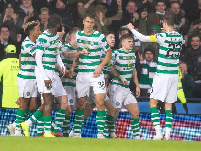 Celtic players celebrate the decisive goal