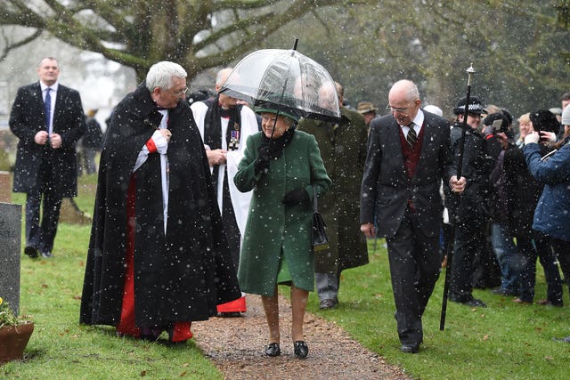 The Queen and family leave the church