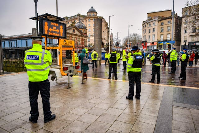 Police officers and Bristol Council Covid marshals meet in the city centre for a briefing during a day of action to reinforce coronavirus lockdown regulations at targeted locations around Bristol