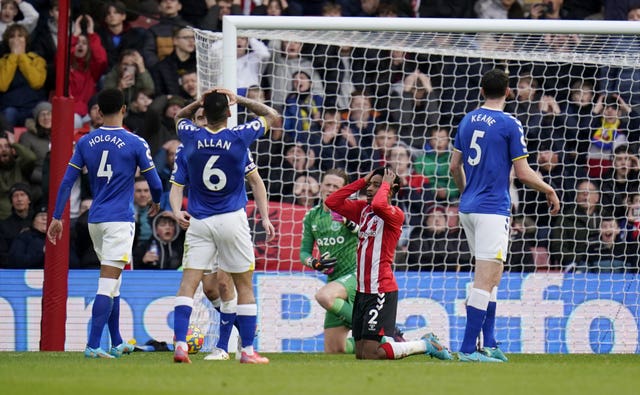 Kyle Walker-Peters, centre, reacts after his shot goes wide