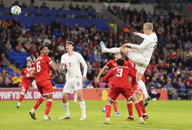 Erling Haaland heads at goal