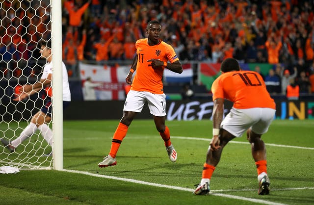Netherlands’ Quincy Promes (centre) celebrates scoring his side’s third goal