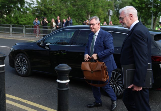 Sir Jeffrey Donaldson (centre) with his solicitor John McBurney as he arrives at Newry Crown Court