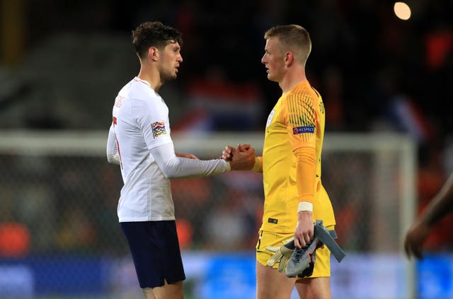 Stones and Pickford commiserate one another at full-time.