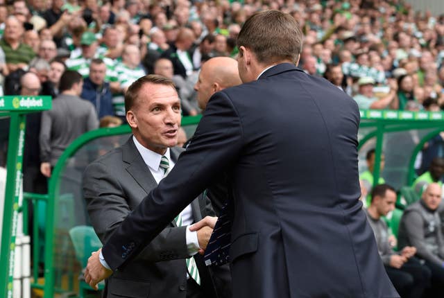 Steven Gerrard and Brendan Rodgers, left, shake hands before the match