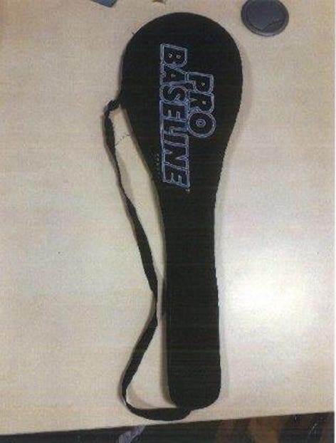 A tennis racquet cover found in the search at the Cheru's home