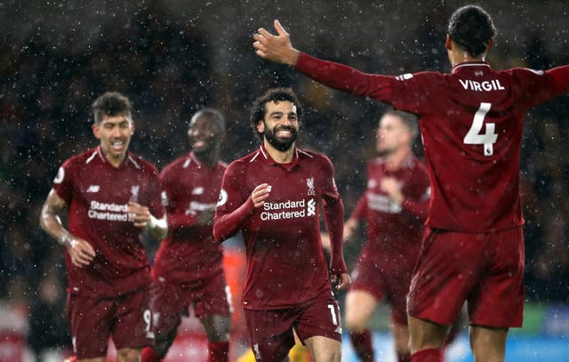 Liverpool’s Mohamed Salah (centre) celebrates. (PA)