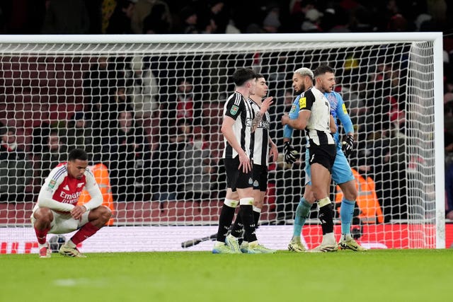 Newcastle players celebrate their win over Arsenal