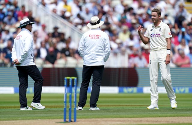 Stuart Broad (right) speaks to the umpires after New Zealand's Devon Conway was given not out