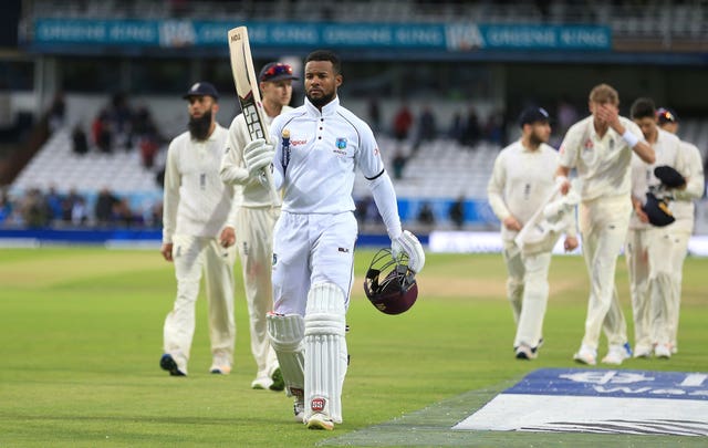 Shai Hope leads the players off after his twin hundreds clinched victory for the West Indies