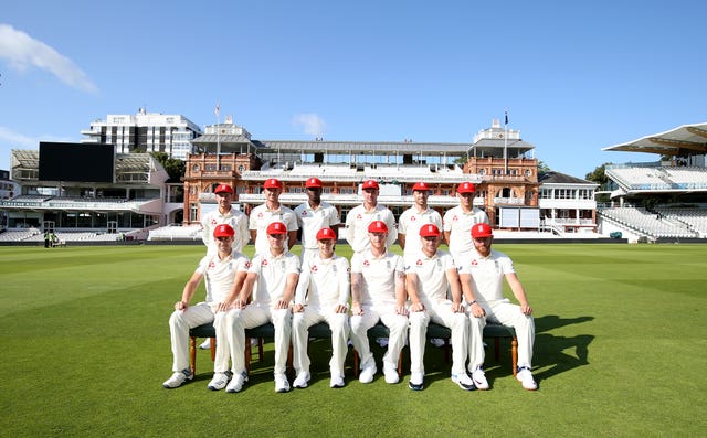 England pose for a team photo in their special edition red caps