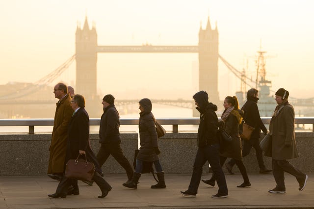 People walking over a London bridge