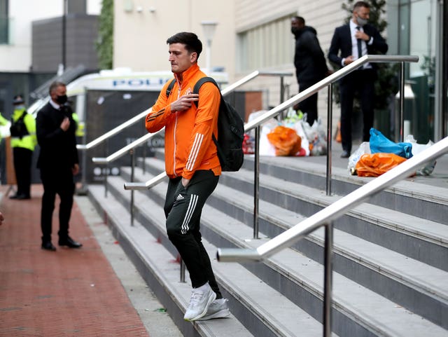 Manchester United captain Harry Maguire leaving the team hotel after the match against Liverpool was called off