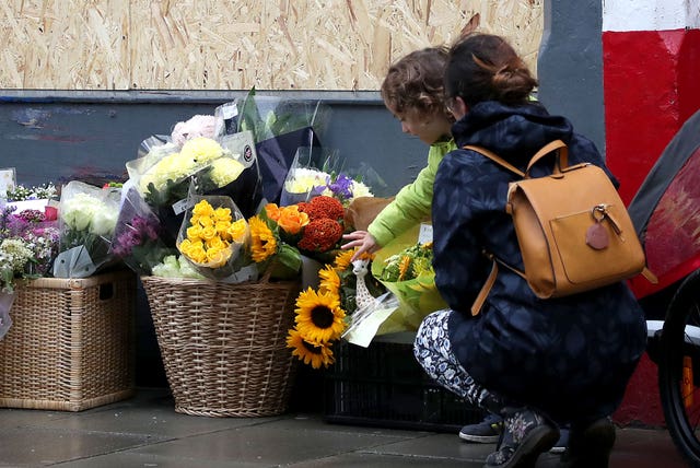 Woman laying tributes