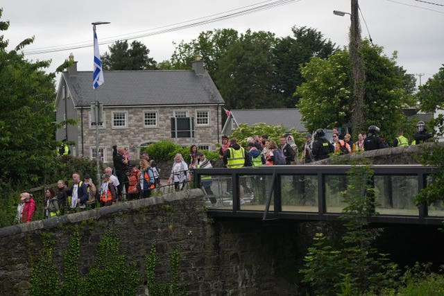 The pro-Palestinian march under protection of officers from the Police Service of Northern Ireland (PSNI) passes closes to the village of Scarva as it travelled from Lurgan to Newry on Saturday
