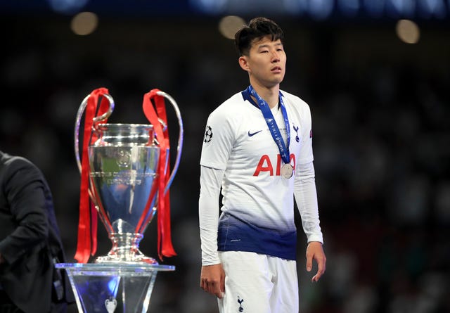 Tottenham’s Son Heung-min walks past the Champions League trophy following defeat by Liverpool in the 2019 final 