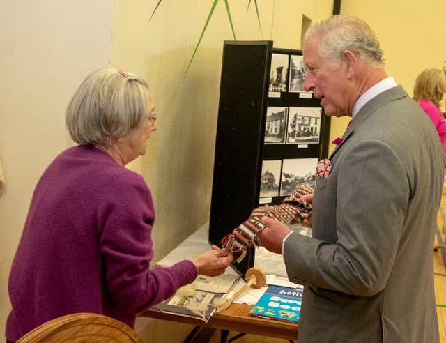 June Cochrane showed Charles a Viking-era sash (Steve Parsons/PA)
