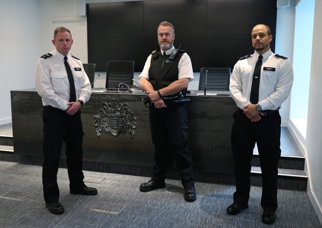 Colleagues of murdered police officer Sergeant Matt Ratana (left to right) Sergeant Gareth Starr, Pc Paul Reading and Sergeant Chris Excell at Scotland Yard
