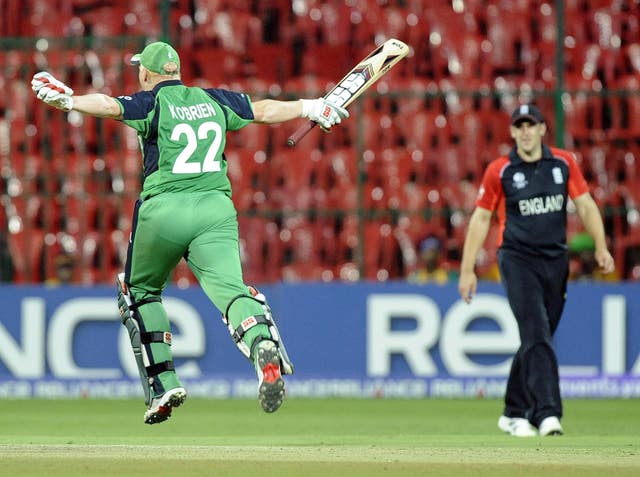 Kevin O'Brien celebrates scoring his World Cup century against England 