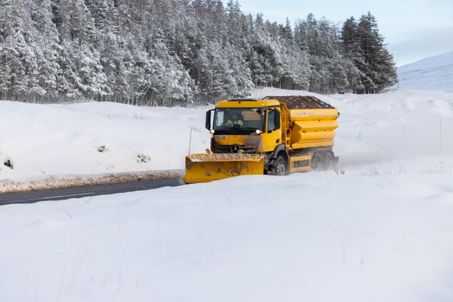 A gritter lorry at work