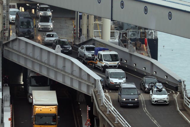 Vehicles are driven off of a ferry at Dover after arriving from France on Friday 