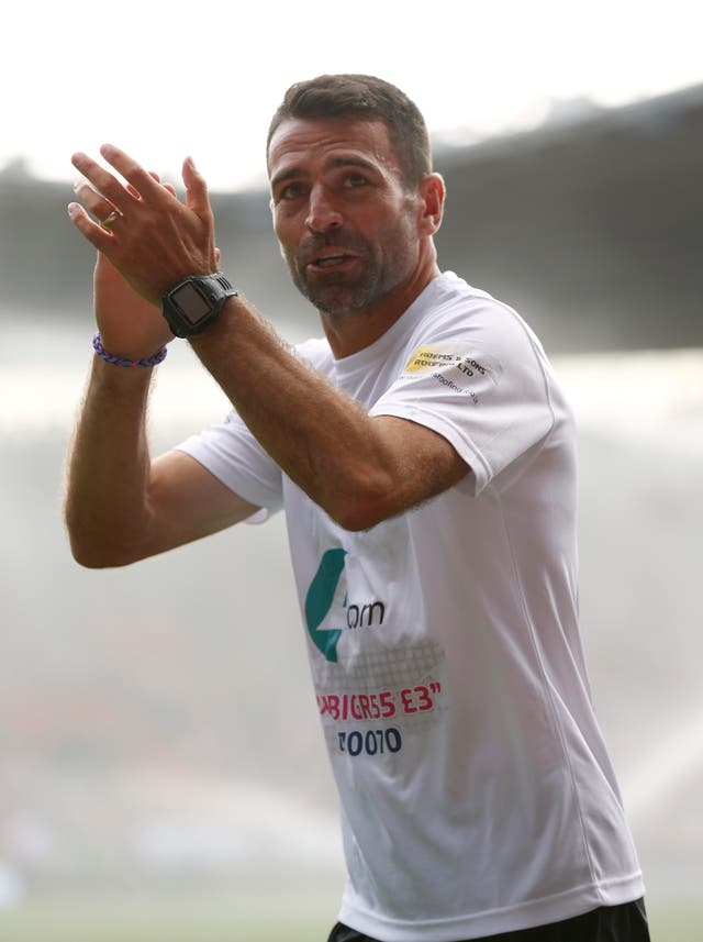 Mr Benali finishes his 2014 challenge (PA)