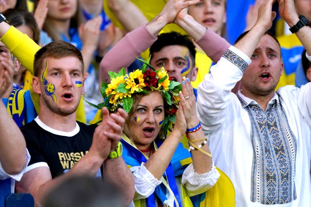Ukraine fans cheer during the game