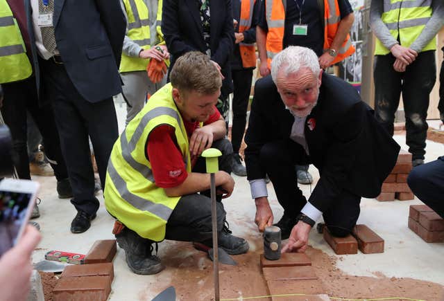 Jeremy Corbyn bricklaying (Owen Humphreys/PA)