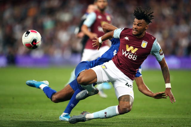 Tyrone Mings clears the ball against Everton