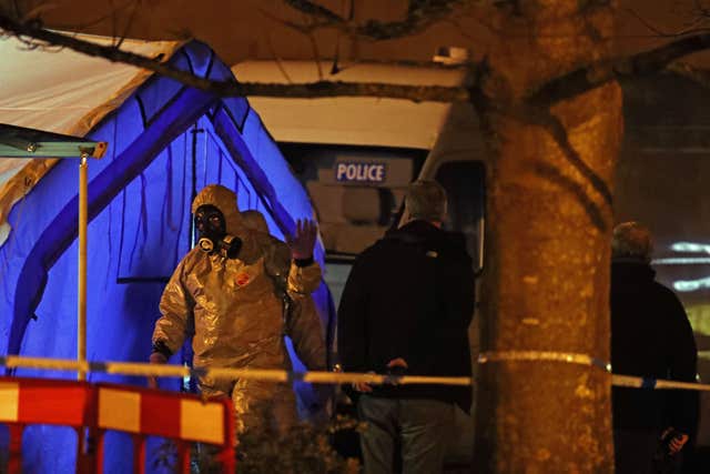 Investigators next to a police tent outside the Mill pub at the Maltings in Salisbury (Steve Parsons/PA)