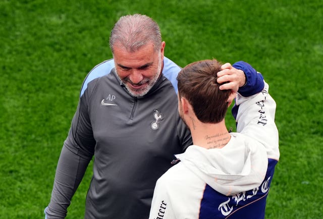 Tottenham head coach Ange Postecoglou with James Maddison during a training session at the Estadio de San Mames in Bilbao