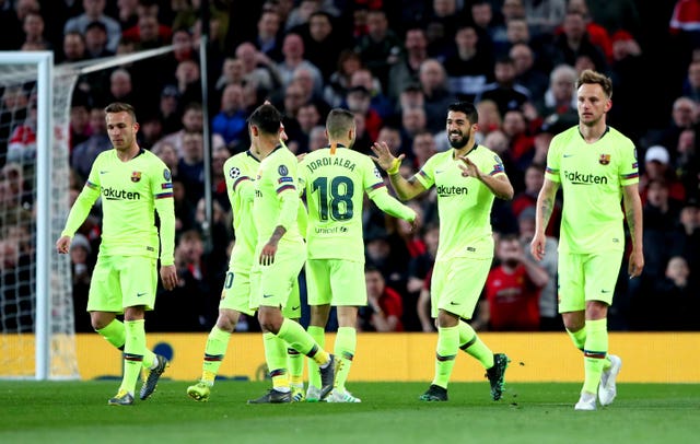 Barcelona's Luis Suarez (second right) celebrates after Luke Shaw had deflected his effort home