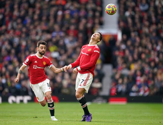 Portugal tam-mates Bruno Fernandes and Cristiano Ronaldo (right) in action for Manchester United