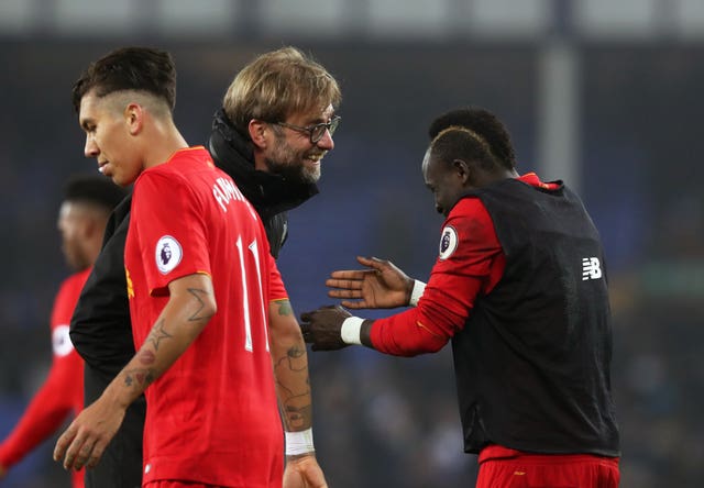 Liverpool boss Jurgen Klopp (centre) has said of Mane (right):